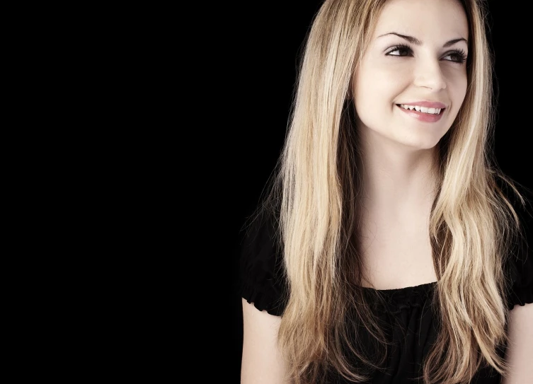 a woman with long blonde hair smiling at the camera, inspired by Rosalie Emslie, shutterstock, bright on black, panoramic centered view of girl, mid shot photo