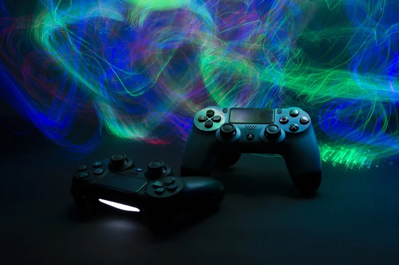 a couple of video game controllers sitting next to each other, a picture, by Adam Marczyński, holography, electric swirls, shot with sony alpha, dramatic gradient lighting, glowing - thin - wires