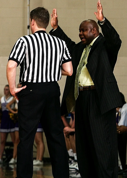 a couple of men standing on top of a basketball court, a picture, by Paul Davis, cobra, yelling, rubbing hands!!!, huell babineaux, afp