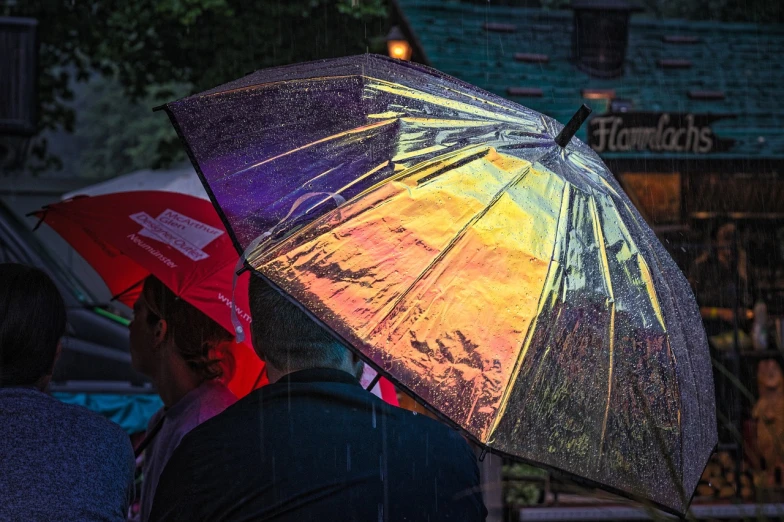 a group of people with umbrellas in the rain, a picture, by Jan Konůpek, pixabay, photorealism, refracted sunset lighting, colourful close up shot, shiny colorful, looking from side