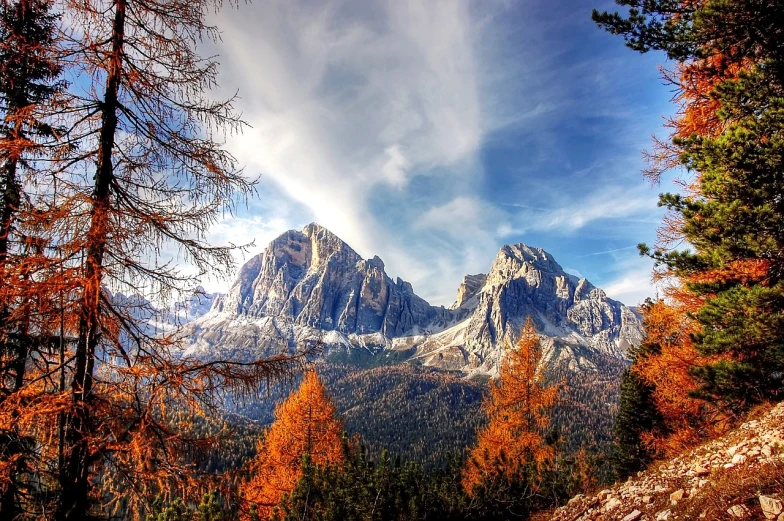 a view of a mountain range with trees in the foreground, a picture, by Luca Zontini, trending on pixabay, 🍁 cute, sienna, 6 4 0, epic scenic shot