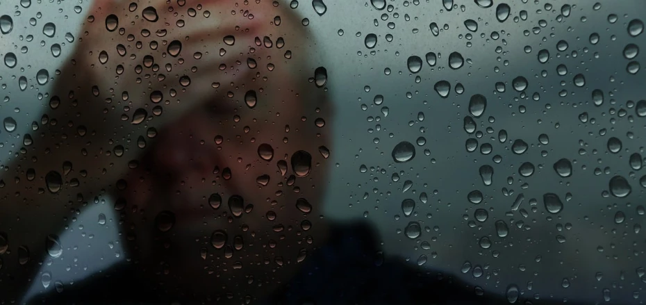 a man standing in front of a rain covered window, a picture, inspired by Jan Rustem, detailed unblurred face, tear drops, wallpaper mobile, high detail portrait photo