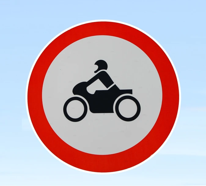 a red and white sign with a picture of a person on a motorcycle, by Leon Polk Smith, pixabay, les automatistes, wearing a round helmet, no sky, costa blanca, stock photo