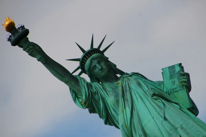 a close up of a statue of liberty holding a torch, a statue, figuration libre, above side view, yummy, arms outstretched, up close picture