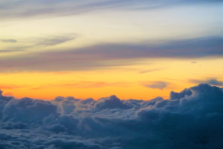 an airplane is flying high above the clouds, a picture, minimalism, (((colorful clouds))), patches of yellow sky, vertical wallpaper, ceremonial clouds