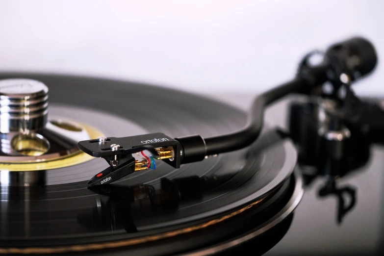 a close up of a record on a turntable, a macro photograph, by Ottó Baditz, figuration libre, cable plugged in, miniature product photo, levers, professional product photography