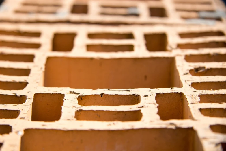 a close up of a building made of bricks, by Matthias Weischer, shutterstock, minimalism, moroccan, hollow, ultra shallow depth of field, rectangles