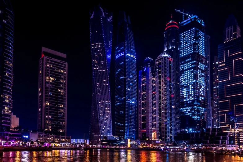 a large body of water surrounded by tall buildings, by Erik Pevernagie, pexels contest winner, digital art, night life buildings, arabia, three towers, ultra hd wallpaper