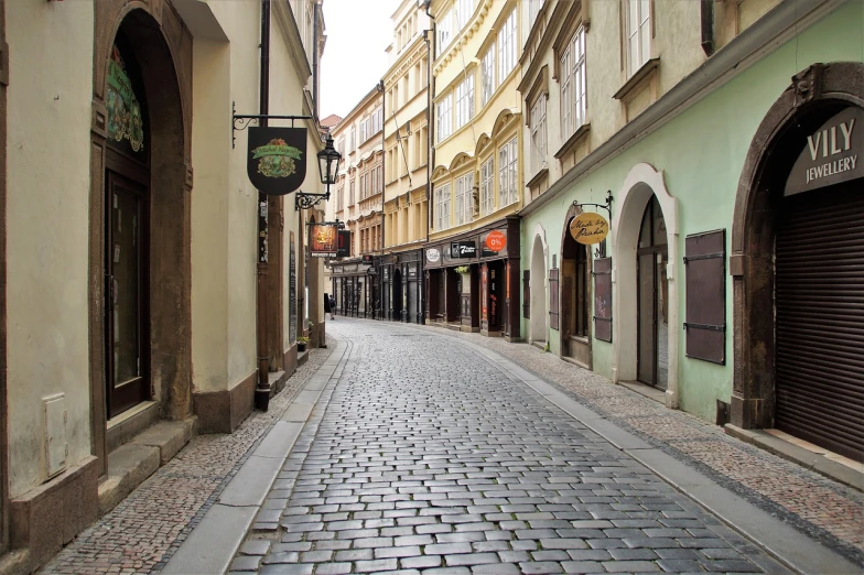 a cobblestone street in a european city, inspired by Slava Raškaj, viennese actionism, completely empty, old pawn shop, wikimedia commons, 1 4 8 0 s