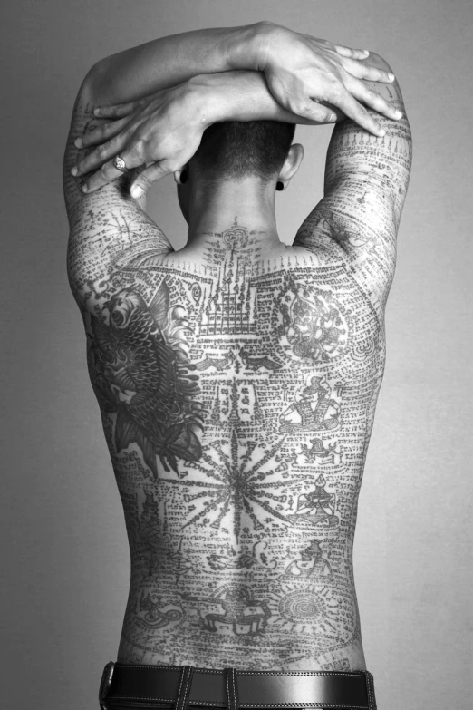 a man with a tattoo on his back, inspired by Menez, tumblr, fine art, ashteroth, cartographic, full-body-shot, buddhist