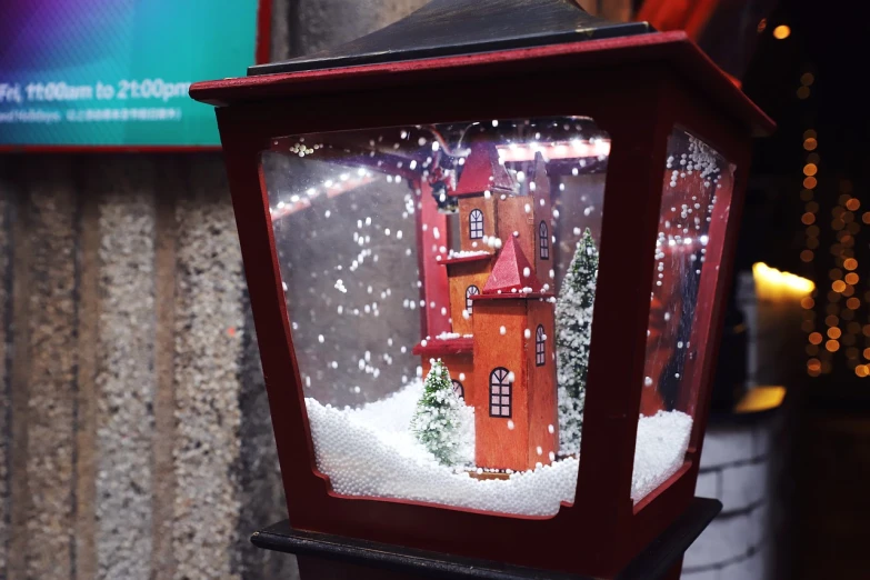 a lamp post with a snow globe inside of it, a tilt shift photo, by senior artist, folk art, red castle in background, shop window for magical weapons, street lanterns are shining, 3d magical details