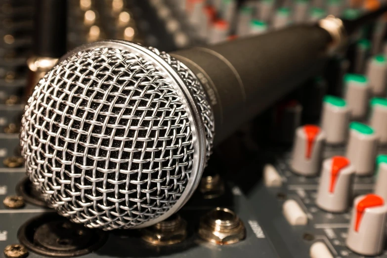 a microphone sitting on top of a sound board, a picture, by Konrad Witz, shutterstock, extremely intricate, rich evans, photo taken in 2018, sing with me