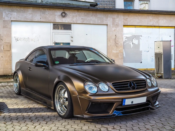 a brown car parked in front of a building, by Thomas Häfner, trending on pixabay, baroque, mercedes, samurai vinyl wrap, rich iridescent colors, extremely highly detailed