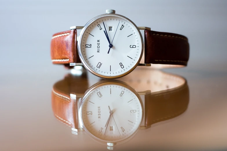 a close up of a wrist watch on a table, a picture, by Jesper Knudsen, pexels contest winner, minimalism, mirrored, brown and white color scheme, white soft leather model, hiper detailed