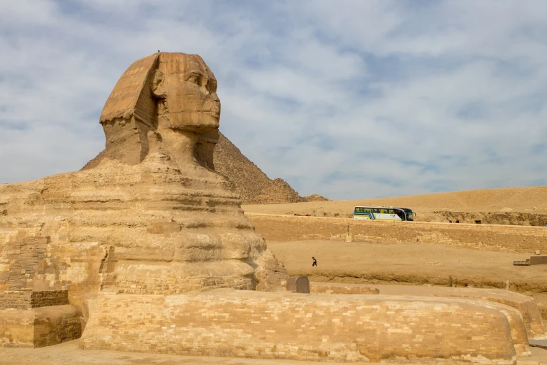 a large sphinx statue in front of a pyramid, by Richard Carline, wide long view, tourist destination, shai hulud, portrait of the mona lisa