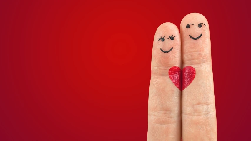 a couple of fingers with smiley faces painted on them, trending on pixabay, romanticism, in red background, heart - shaped face, slide show, with wart