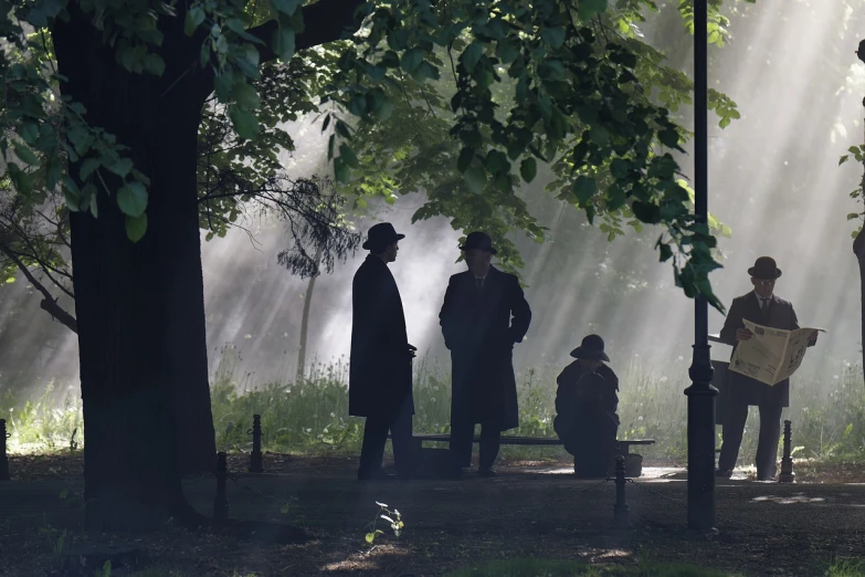 a group of people sitting on a park bench, a picture, by Dariusz Zawadzki, romanticism, roger deakins filming, sherlock holmes, sunbeams, hides in the shadows of trees