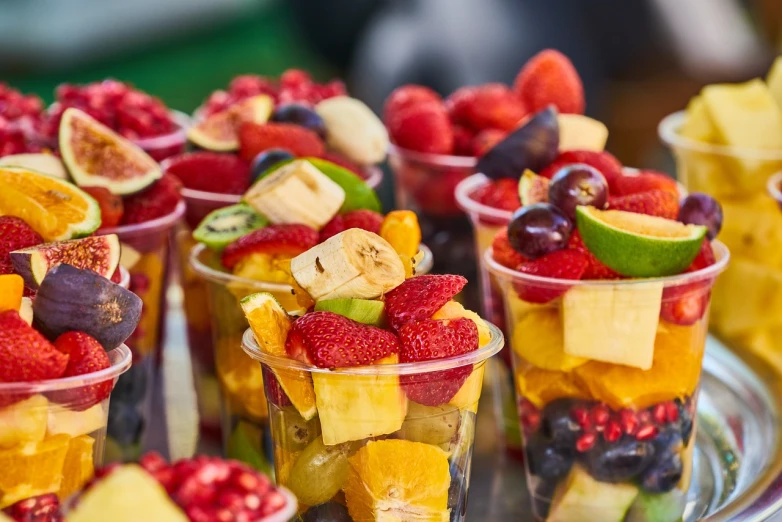 a tray of fruit cups sitting on top of a table, shutterstock, close up food photography, 🦩🪐🐞👩🏻🦳, event photography, morning detail