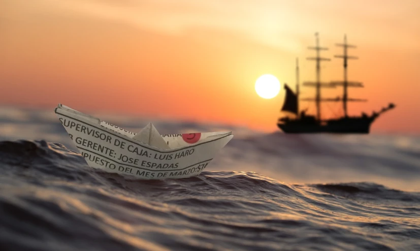 a paper boat floating on top of a body of water, a tilt shift photo, inspired by José Malhoa, watching the sunset, pirate ship in background, notan sun in the background, corona