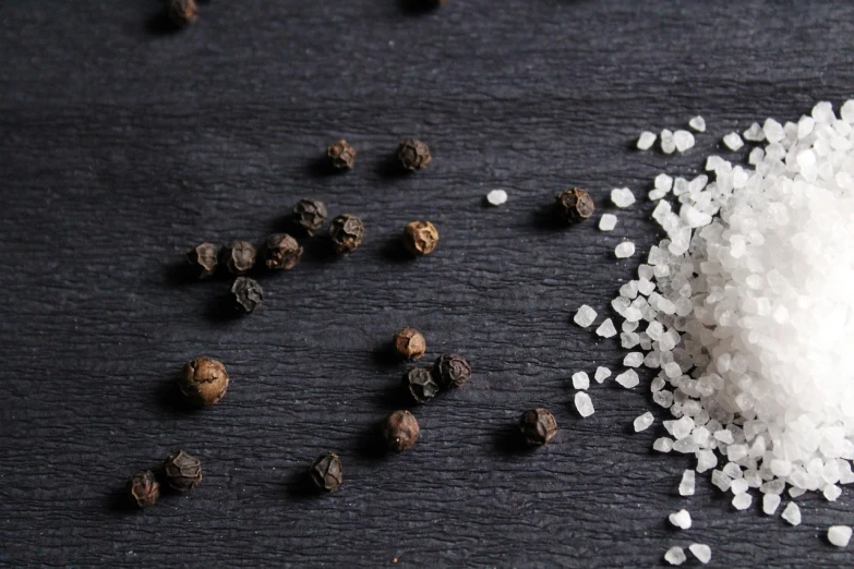 a pile of salt sitting on top of a table, a portrait, pexels, pepper, 1 5 9 5, jasmine, recipe