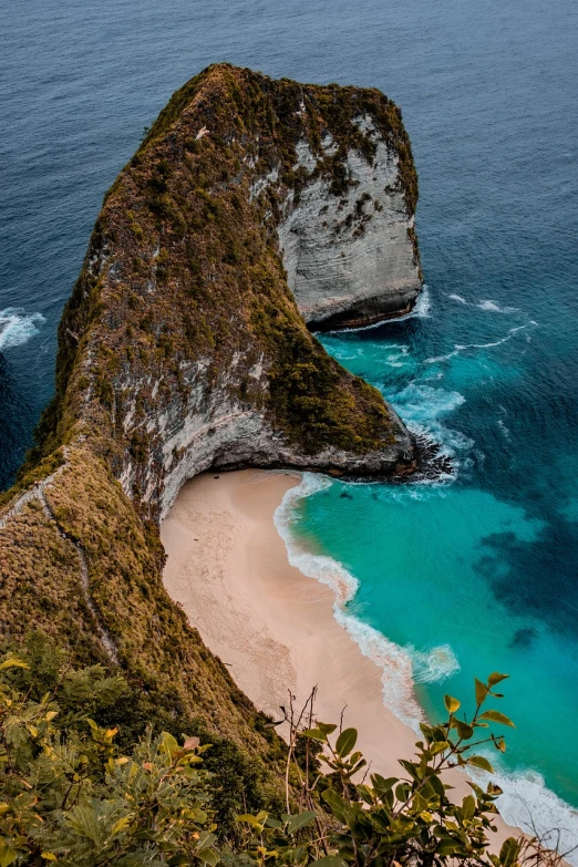 a large body of water next to a sandy beach, a picture, by Daniel Seghers, pexels contest winner, sumatraism, steep cliffs, vertical composition, awesome greate composition, beautiful curves