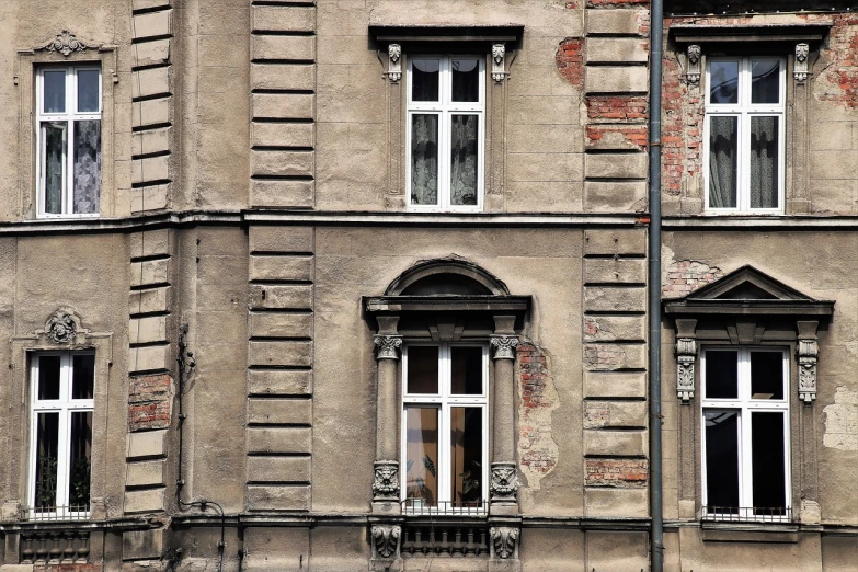 a couple of windows sitting on the side of a building, inspired by Walenty Wańkowicz, shutterstock, aged photo, broken buildings, high details photo, 3 4 5 3 1