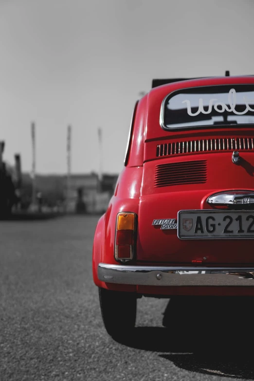 a red car parked in a parking lot, pexels contest winner, graffiti, italian looking emma, rear view, weenie, classic cars