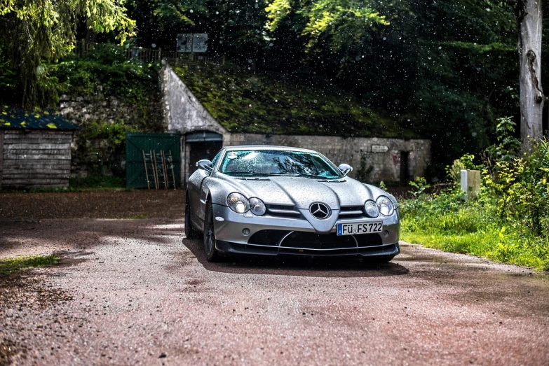 a silver sports car parked on the side of a road, a portrait, by Etienne Delessert, mercedes, slr, 🤬 🤮 💕 🎀, marble!! (eos 5ds r