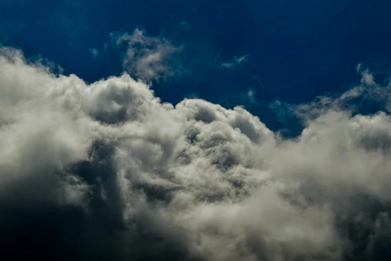 a jetliner flying through a cloudy blue sky, a picture, by Hans Schwarz, heavy rain from thick clouds, hdr detail, fat cloud, a dragon made of clouds