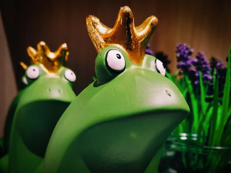 a close up of a frog with a crown on its head, inspired by Jeff Koons, pexels, carved soap, 🕹️ 😎 🔫 🤖 🚬, pepe the frogs at war, moomins