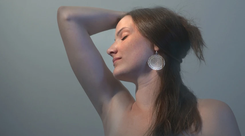 a close up of a woman with long hair, by Anna Füssli, silver earrings, backlight body, armpit, organic and intricate