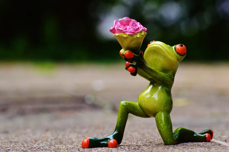 a figurine of a frog with a flower in its mouth, pixabay contest winner, romanticism, carrying flowers, love is begin of all, on his hind legs, photo of a rose