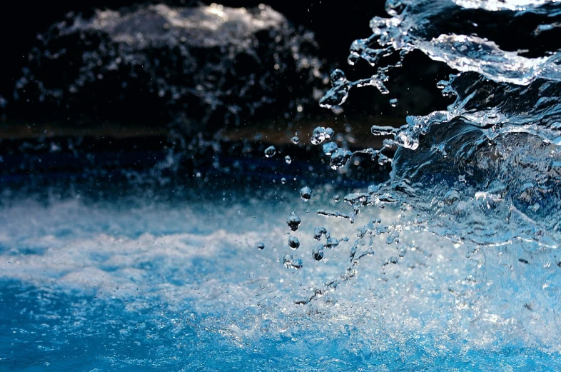 a close up of water coming out of a pool, a macro photograph, by Hans Schwarz, wallpaper anime blue water, detailed hd photography, ultra hd wallpaper, water running down the walls