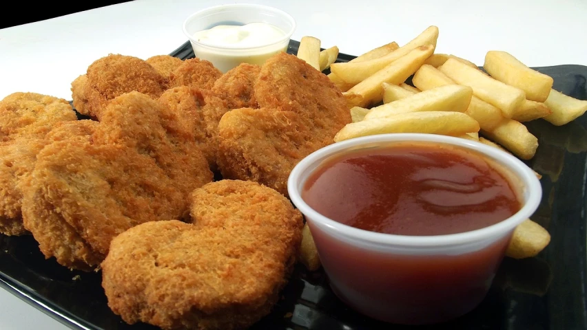 a close up of a plate of food with fries and ketchup, flickr, dau-al-set, chicken nuggets, (heart), closeup - view, order now