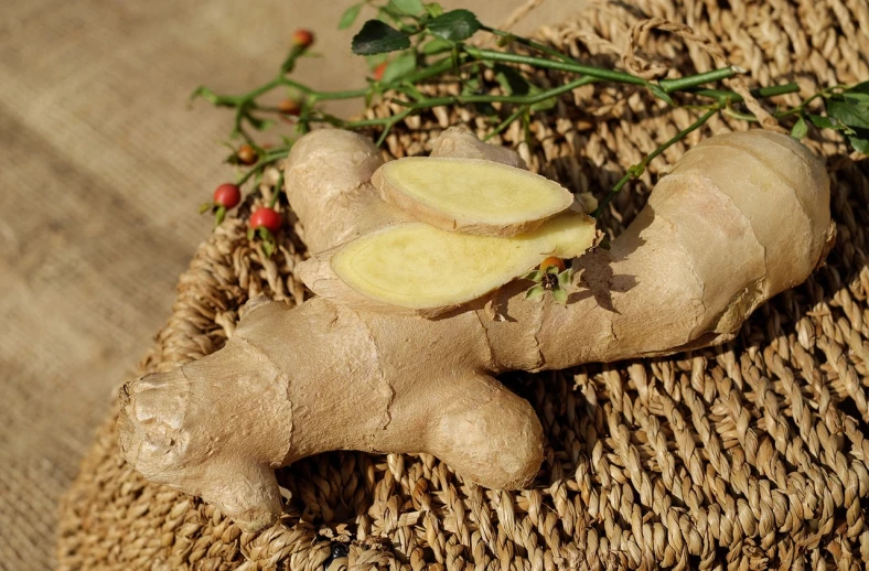 a close up of a piece of ginger on a table, inspired by Phyllis Ginger, pixabay, 👰 🏇 ❌ 🍃, close up of iwakura lain, herbs, cornucopia