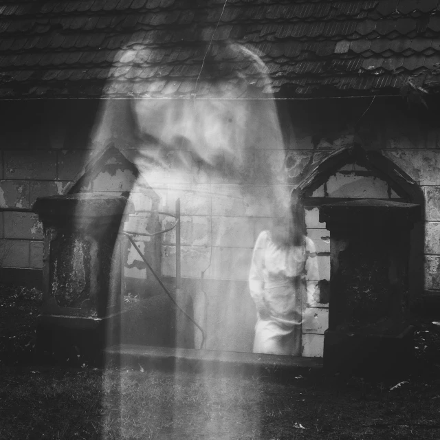 a black and white photo of a person standing in front of a building, by Gusztáv Kelety, pexels contest winner, surrealism, halloween wallpaper with ghosts, blurry photography, children born as ghosts, in a graveyard