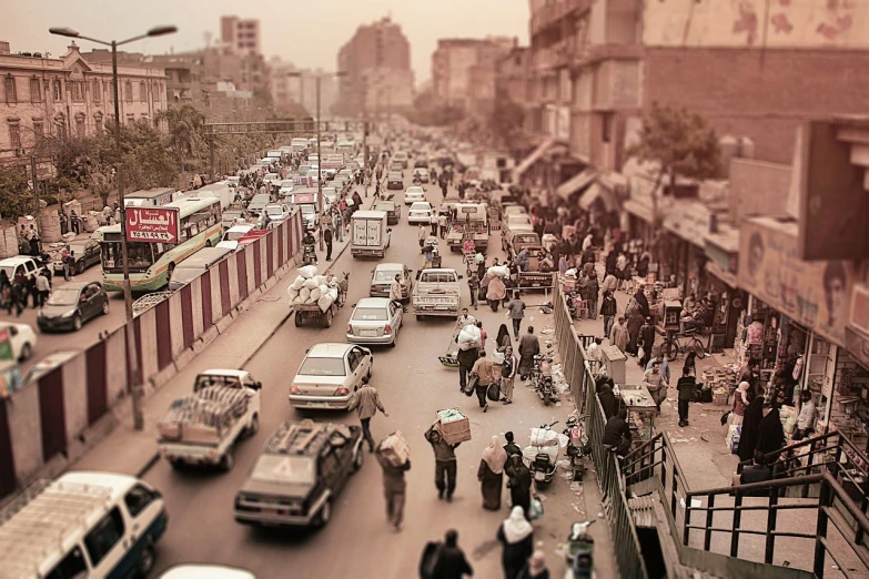 a busy city street filled with lots of traffic, by Ahmed Yacoubi, flickr, happening, old color photo, dusty air, cute:2, some people around ”