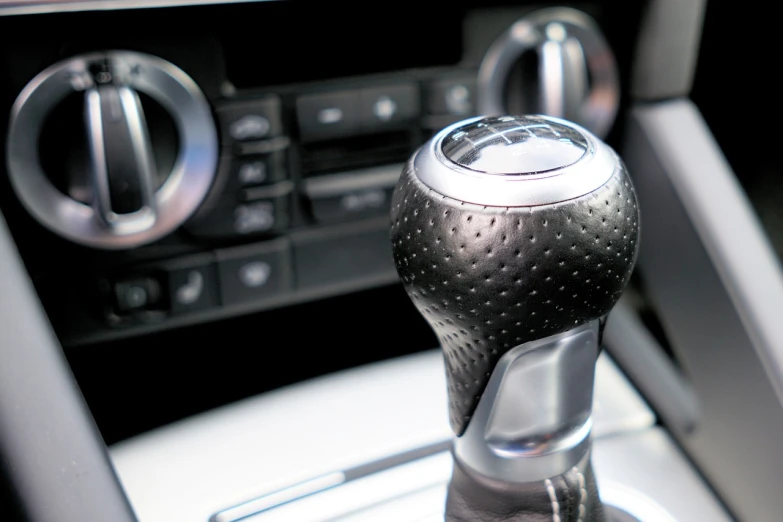 a close up of a gear stick in a car, a stock photo, shutterstock, cobra, alterd carbon, triumph, high detail”, realistic”