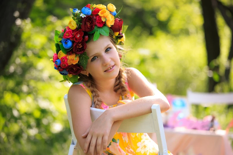 a girl sitting in a chair with a flower crown on her head, by Marie Bashkirtseff, pixabay contest winner, colorful hd picure, istockphoto, traditional russia, bright summer day