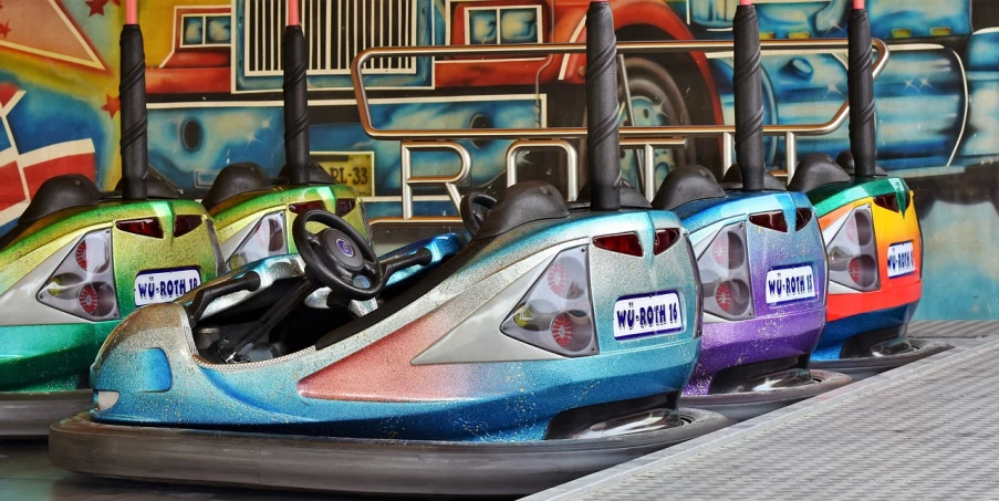 a row of bumper cars sitting next to each other, an airbrush painting, horns with indicator lights, dreamworld, william henrits, middle close up