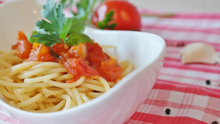 a bowl of spaghetti with tomato sauce and parsley, inspired by Italo Mus, pixabay, portrait closeup, wikimedia commons, stock photo