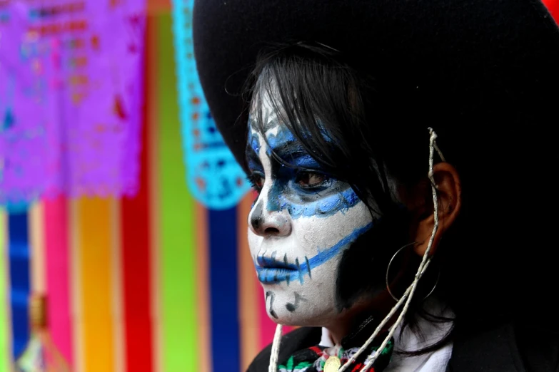 a close up of a person with face paint, a portrait, by Gina Pellón, pexels contest winner, sombrero, skeleton girl, blue faces, watermarked