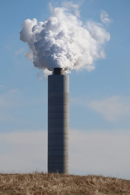 a large tower with a lot of smoke coming out of it, shutterstock, ventilation shafts, colorado, 2 0 1 0 photo, tall columns