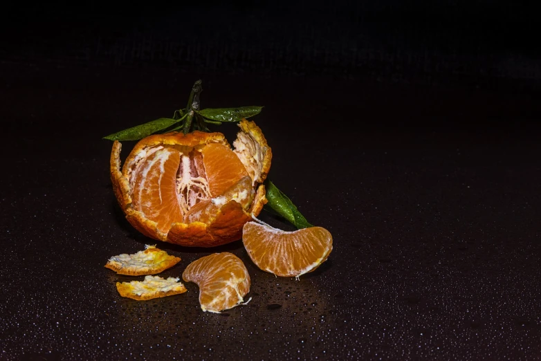 a peeled orange sitting on top of a table, a still life, late night melancholic photo, still life vegetables, sleet, garbage