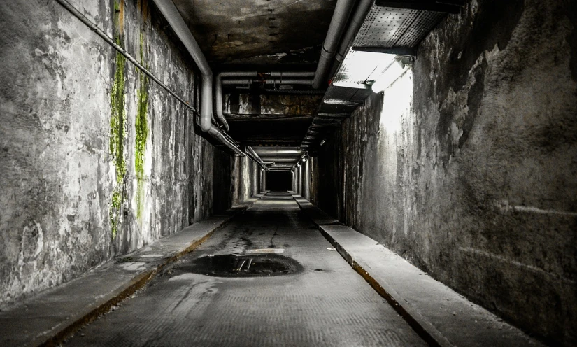 a black and white photo of a dark tunnel, by Hans Schwarz, flickr, nuclear art, green alleys, eerie color, tonemapped, military base