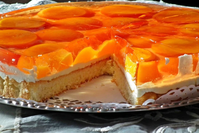 a cake with a slice taken out of it, by Helen Dahm, trending on pixabay, bauhaus, jelly - like texture, orange and white, shiny crisp finish, tamborine