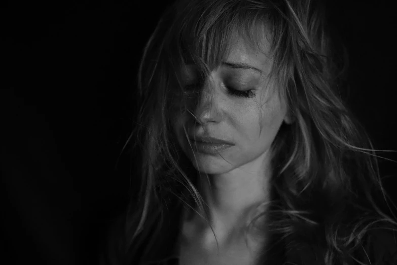 a black and white photo of a woman with her eyes closed, by Dimitre Manassiev Mehandjiysky, pexels, digital art, movie still of a tired, portrait. 8 k high definition, woman crying, side profile waist up portrait