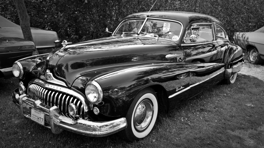 a black and white photo of a classic car, by Arnie Swekel, fine art, july 2 0 1 1, looking regal and classic, phone photo, 1 9 4 8 photo