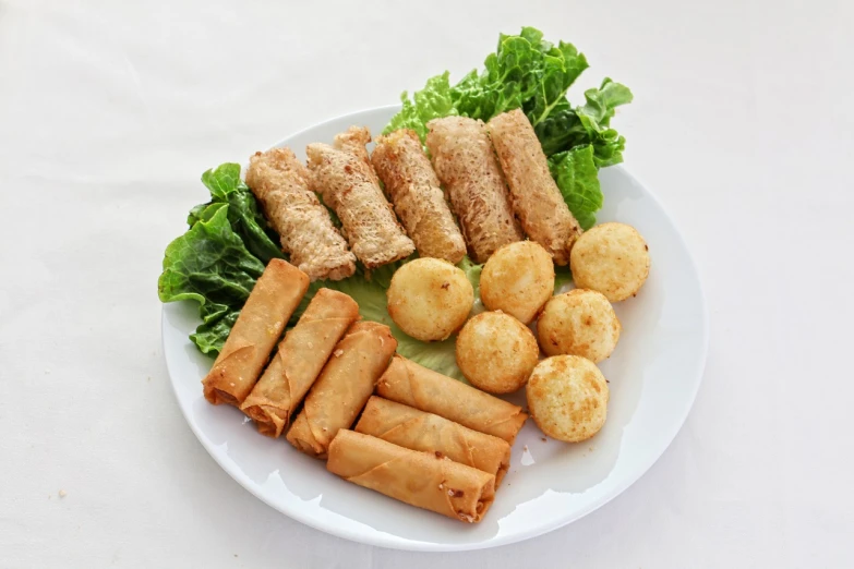 a close up of a plate of food on a table, inspired by Mi Fu, dau-al-set, crispy quality, various sizes, stuffed, 2 years old