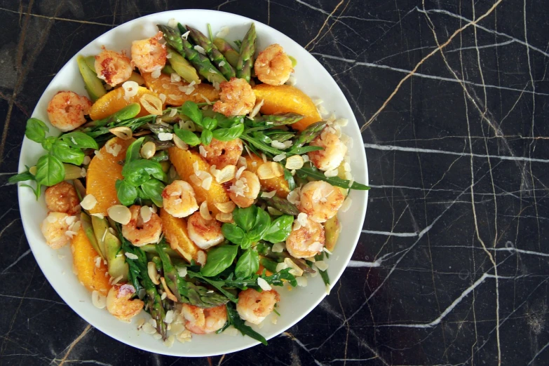 a close up of a plate of food on a table, by Meredith Dillman, shrimp, peach, standing triumphant and proud, salad